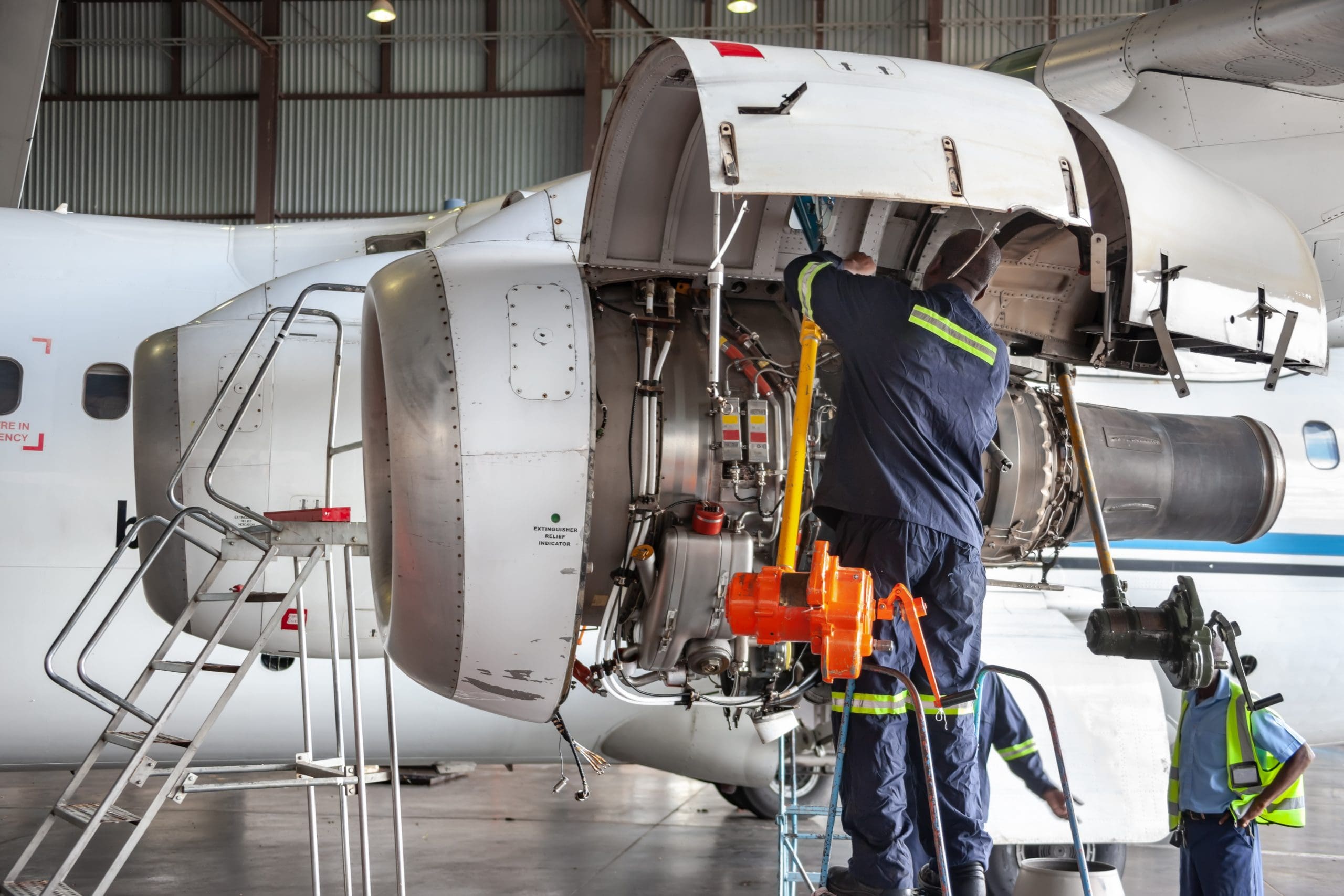 Aerospace mechanics working on repairs