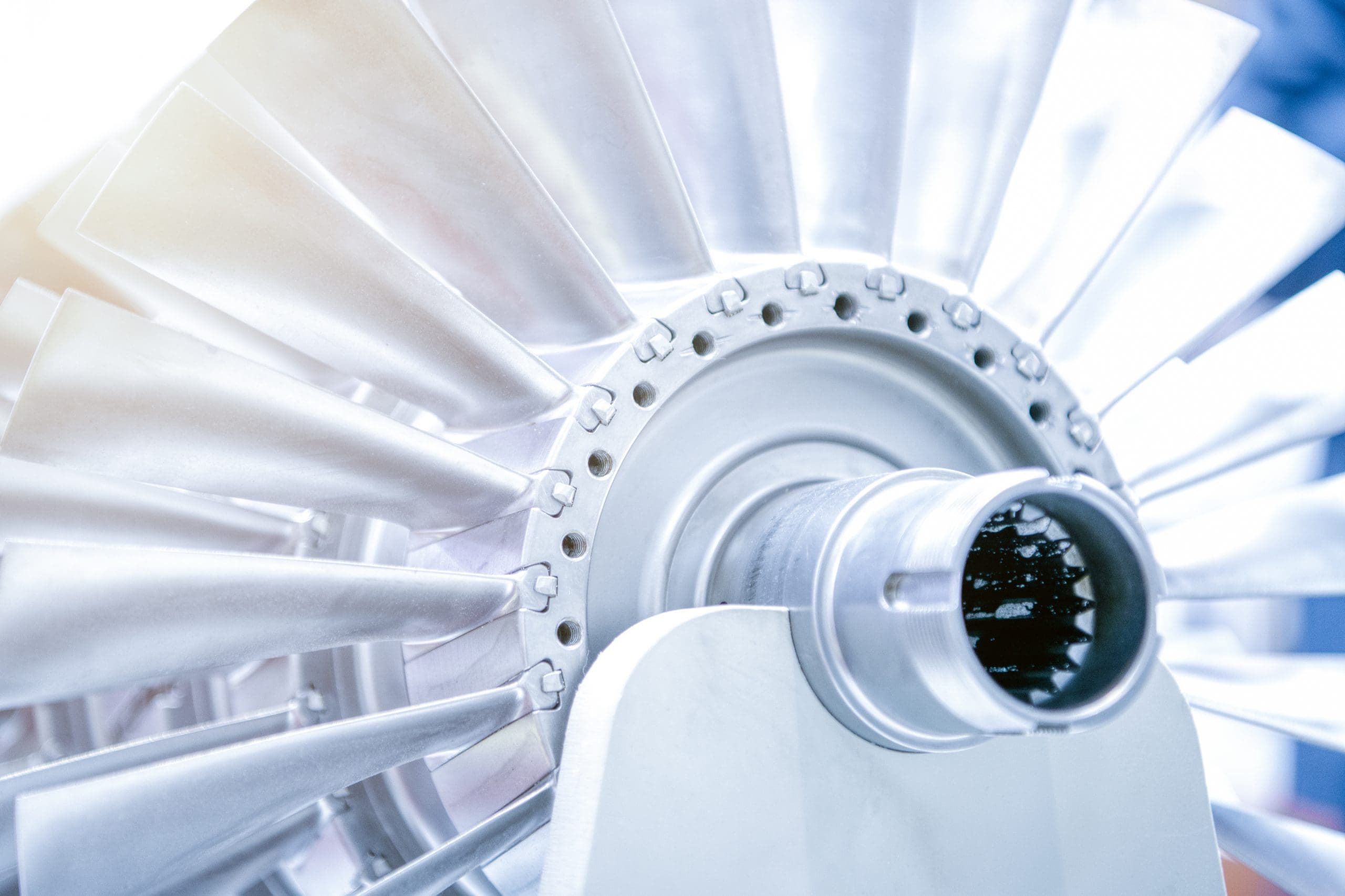 Wheel of the air compressor of an aircraft engine. Replacement of the jet engine.Turbine blades closeup. Shallow depth of field.