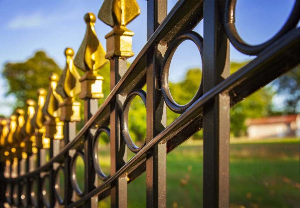 wrought iron fence with decorative golden colored tips