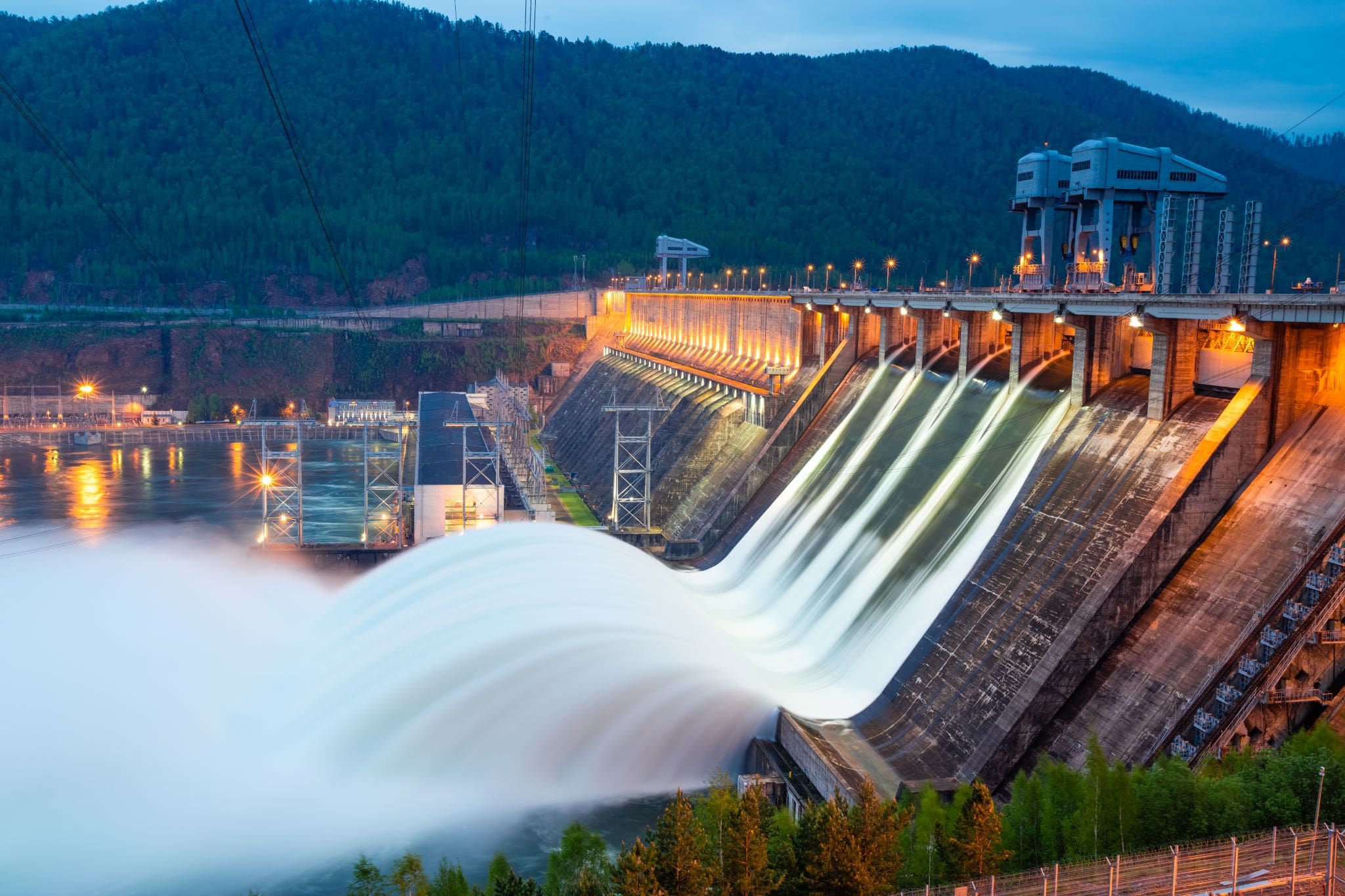 View of hydroelectric dam with water discharging through its locks