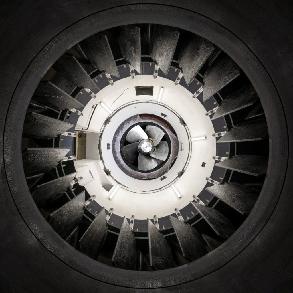 Bottom up view of a turbine and guide planes at a hydropower plant