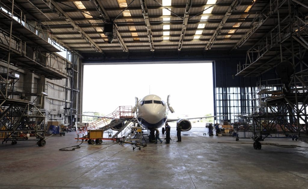 Airplane in hangar prepared for maintenance, repair, and overhaul services