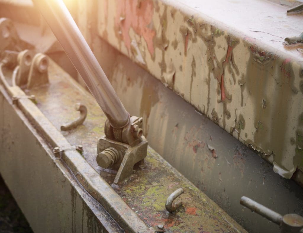 Close up image of metal surface corrosion ready for military vehicle repair