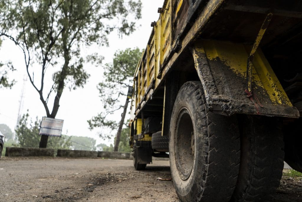 Low angle shot of a old rusted carrying truck parked. hvof coating cold spray plasma coating thermal coating corrosion resistant coating