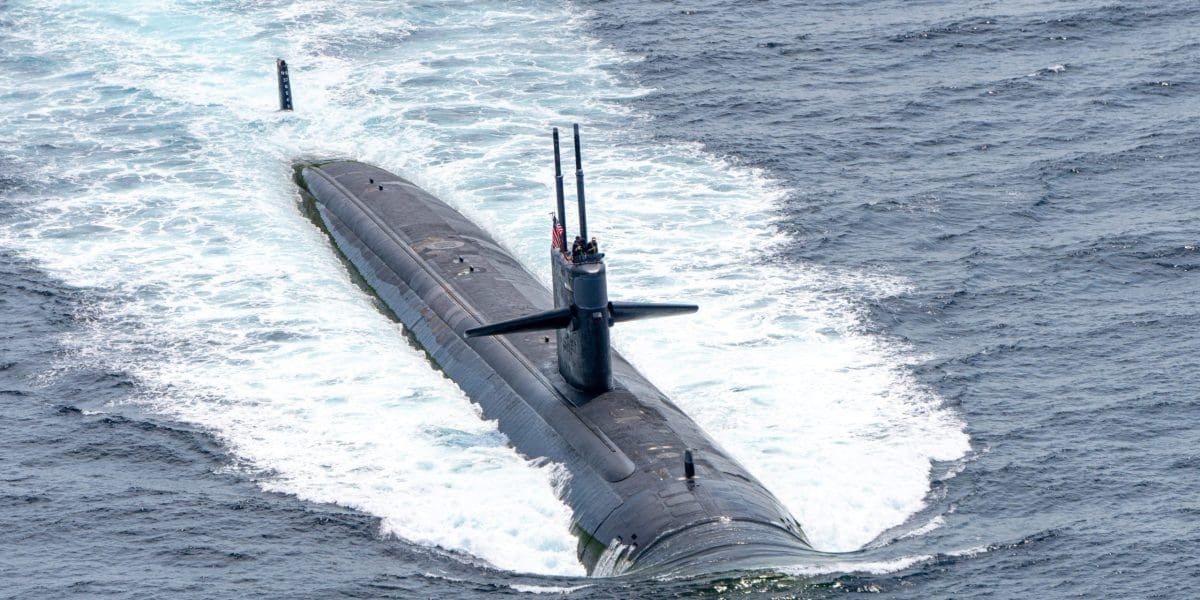 USS Louisville fast attack submarine of U.S.Navy sails on the su
